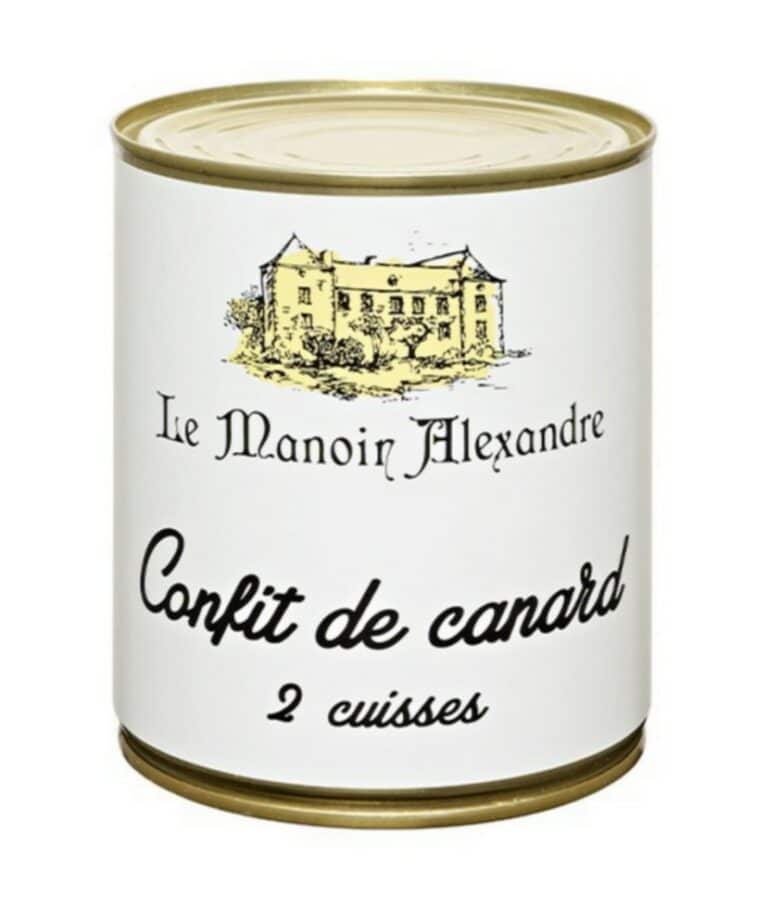 Burk med Manoir Alexandre Confiterade Anklår (Confit de Canard) 800g, visad med två tillagade ankben på en tallrik, serverade med vitlökspotatis och rosmarin.