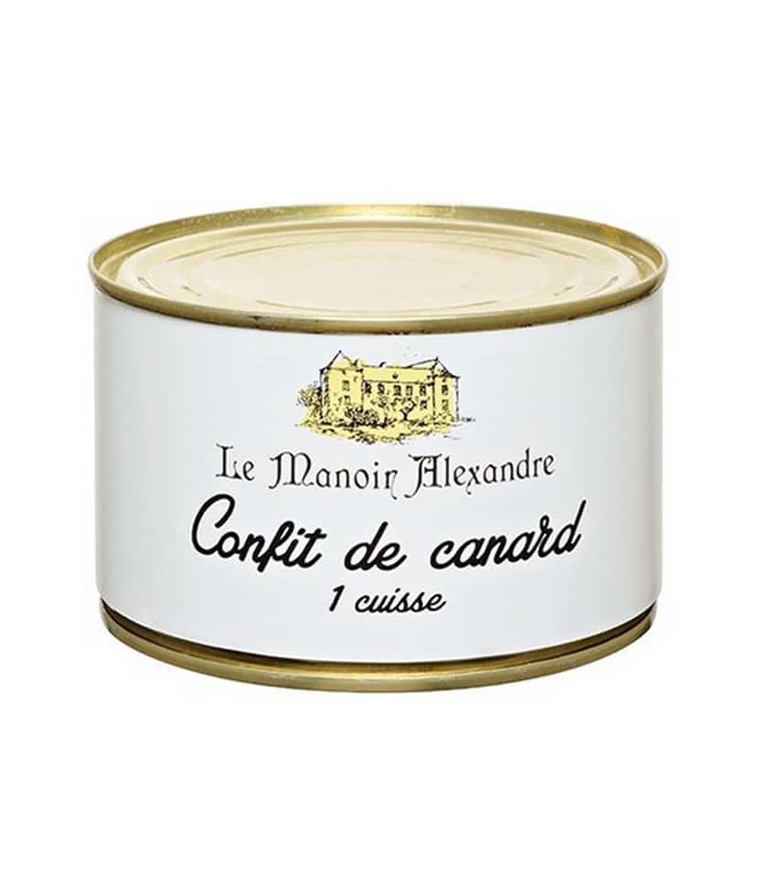Burk med Manoir Alexandre Confiterat Anklår 383g, visad med ett tillagat lår på en tallrik tillsammans med potatis och persilja.